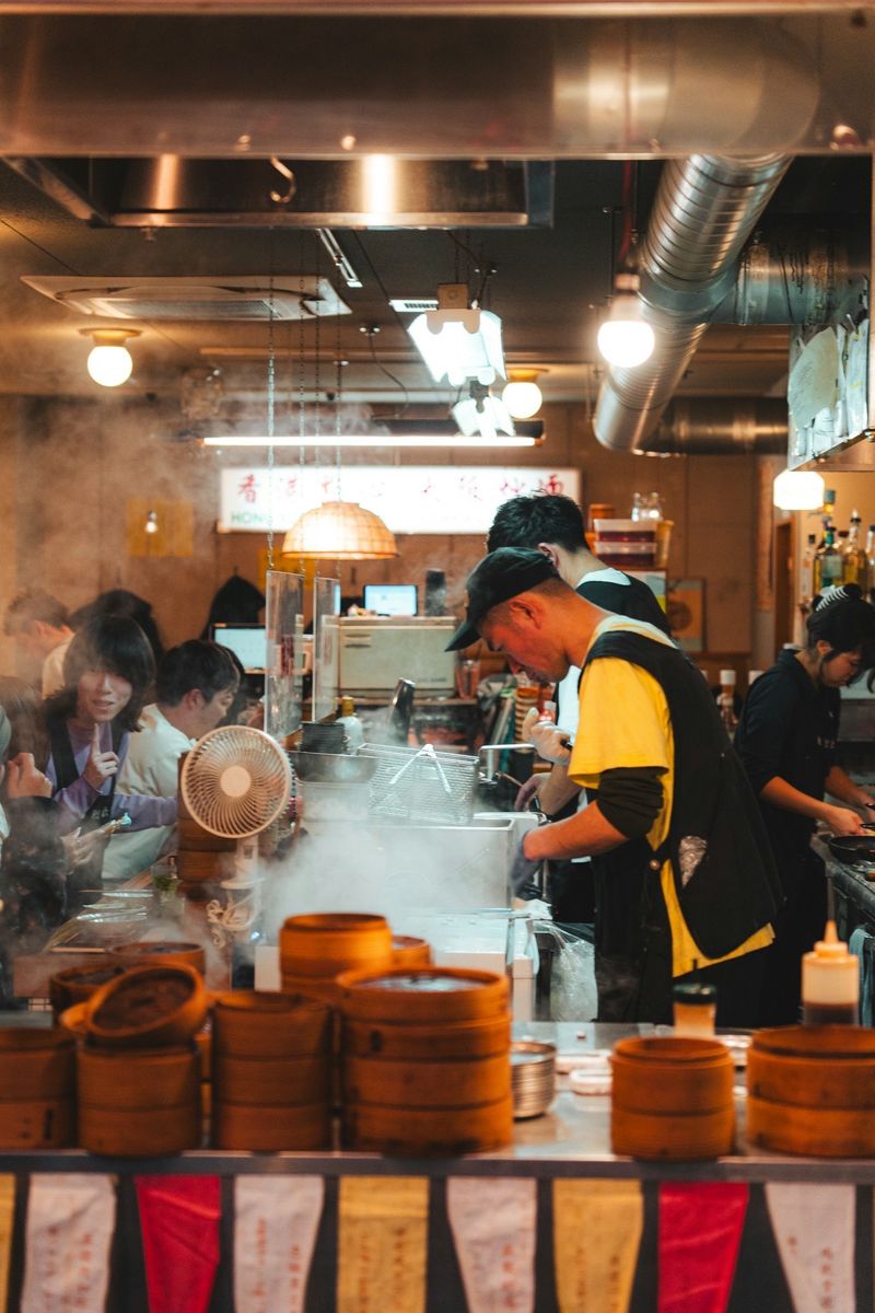 Cooks at work in a busy restaurant kitchen
